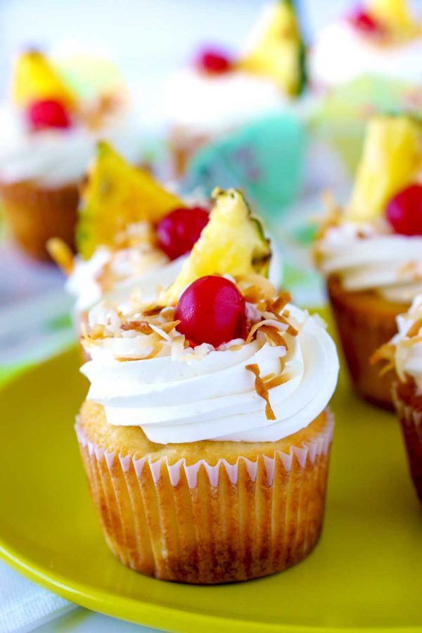 Coconut-pineapple cupcakes with coconut cream cheese frosting.