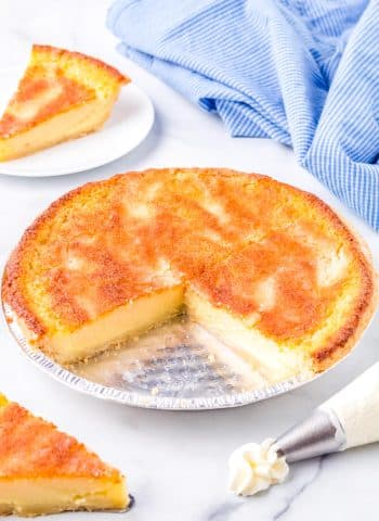 The finished Buttermilk Pie with a big slice taken out of it so you can se what the interior of the pie looks like.
