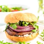 Portobello Mushroom Burger on a white plate with arugula.