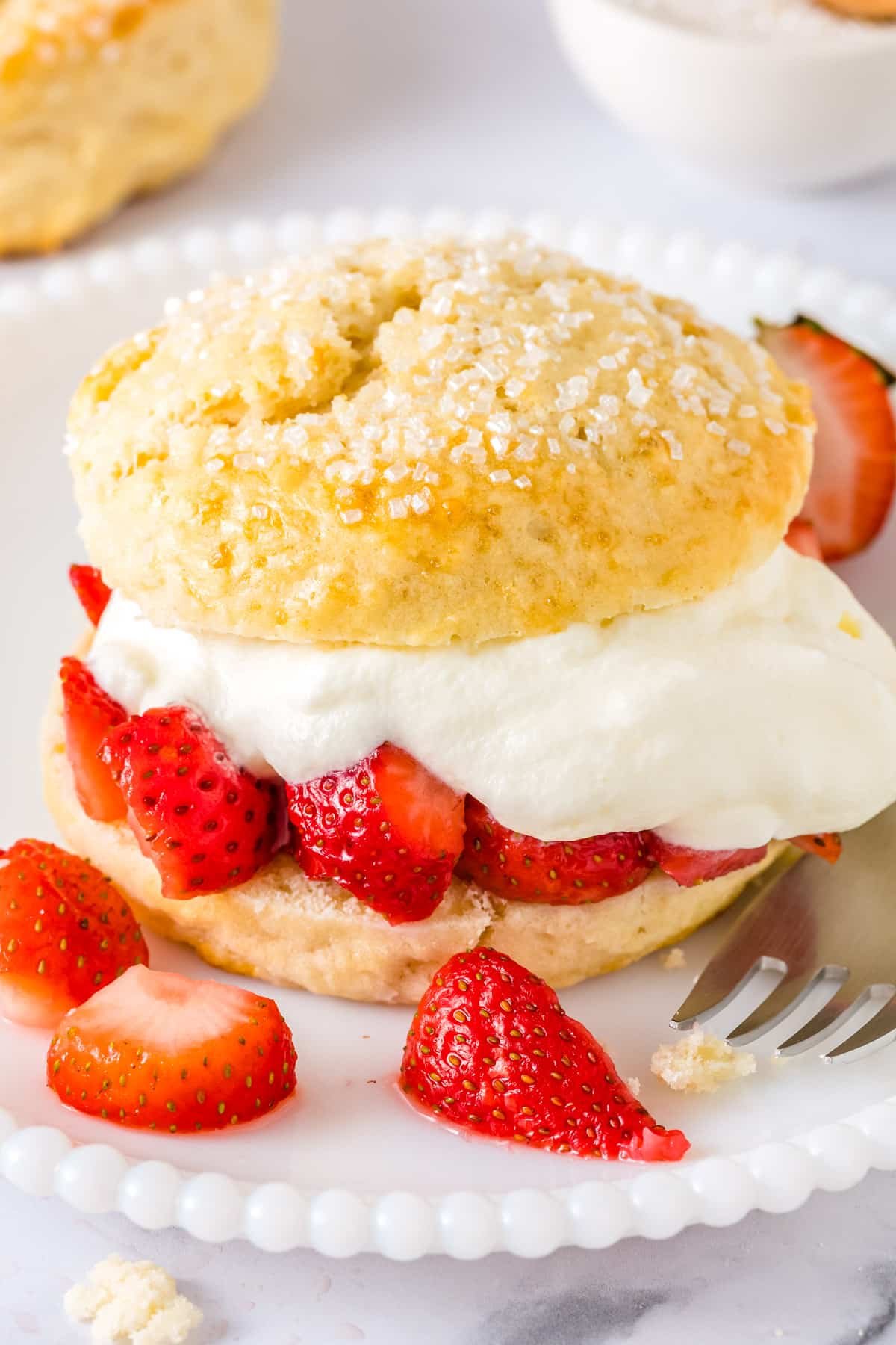 The finished Shortcake Biscuits cut in half and filled with strawberries and cream.