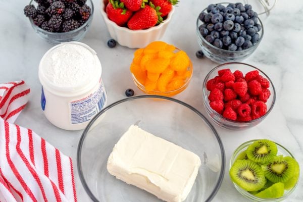 All of the ingredients needed to make fruit pizza.