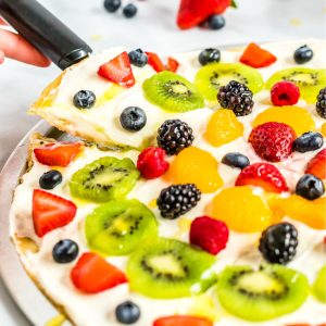 The finished fruit pizza with text overlay for Pinterest.