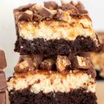 Two Cheesecake Brownies stacked on top of each other.