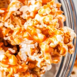 Caramel Popcorn in a glass serving bowl.