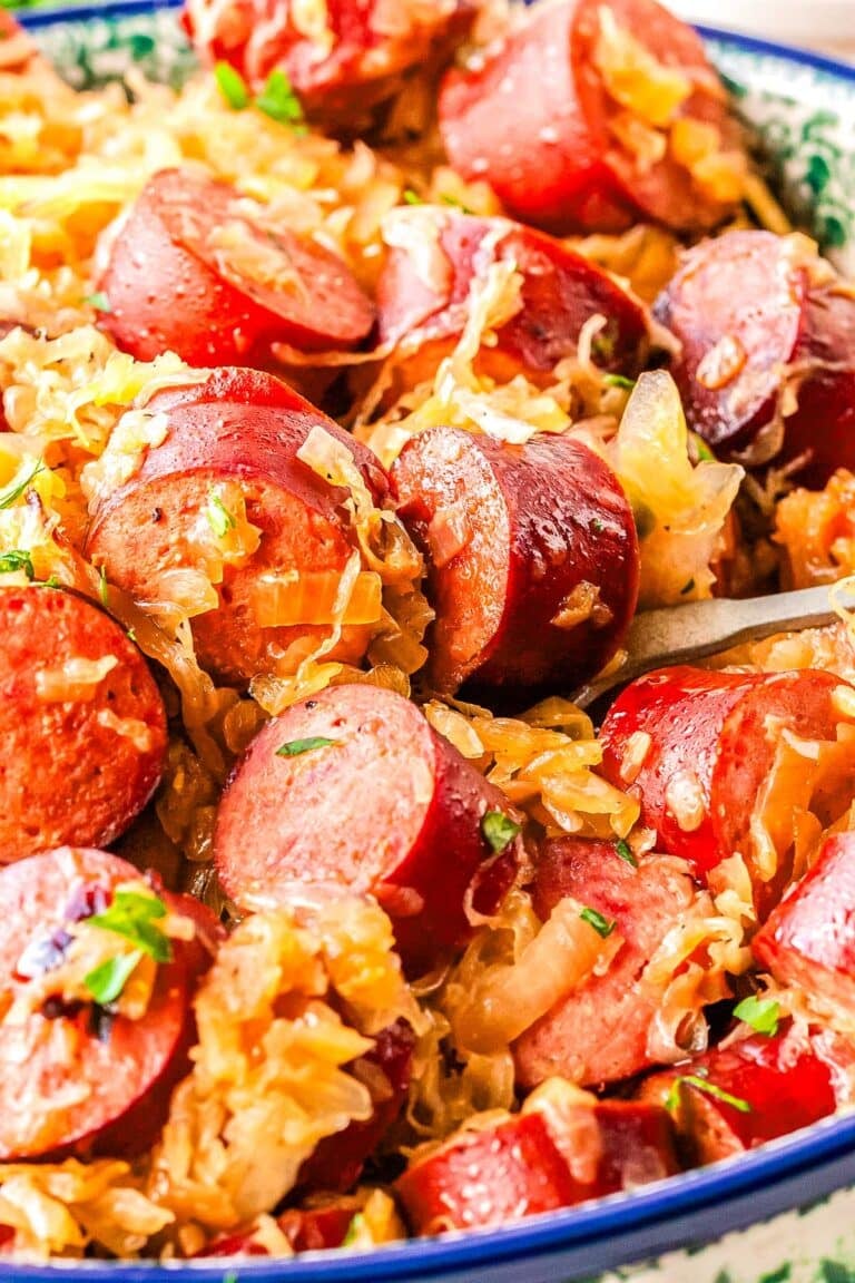 Kapusta and kielbasa in a Polish pottery serving dish.