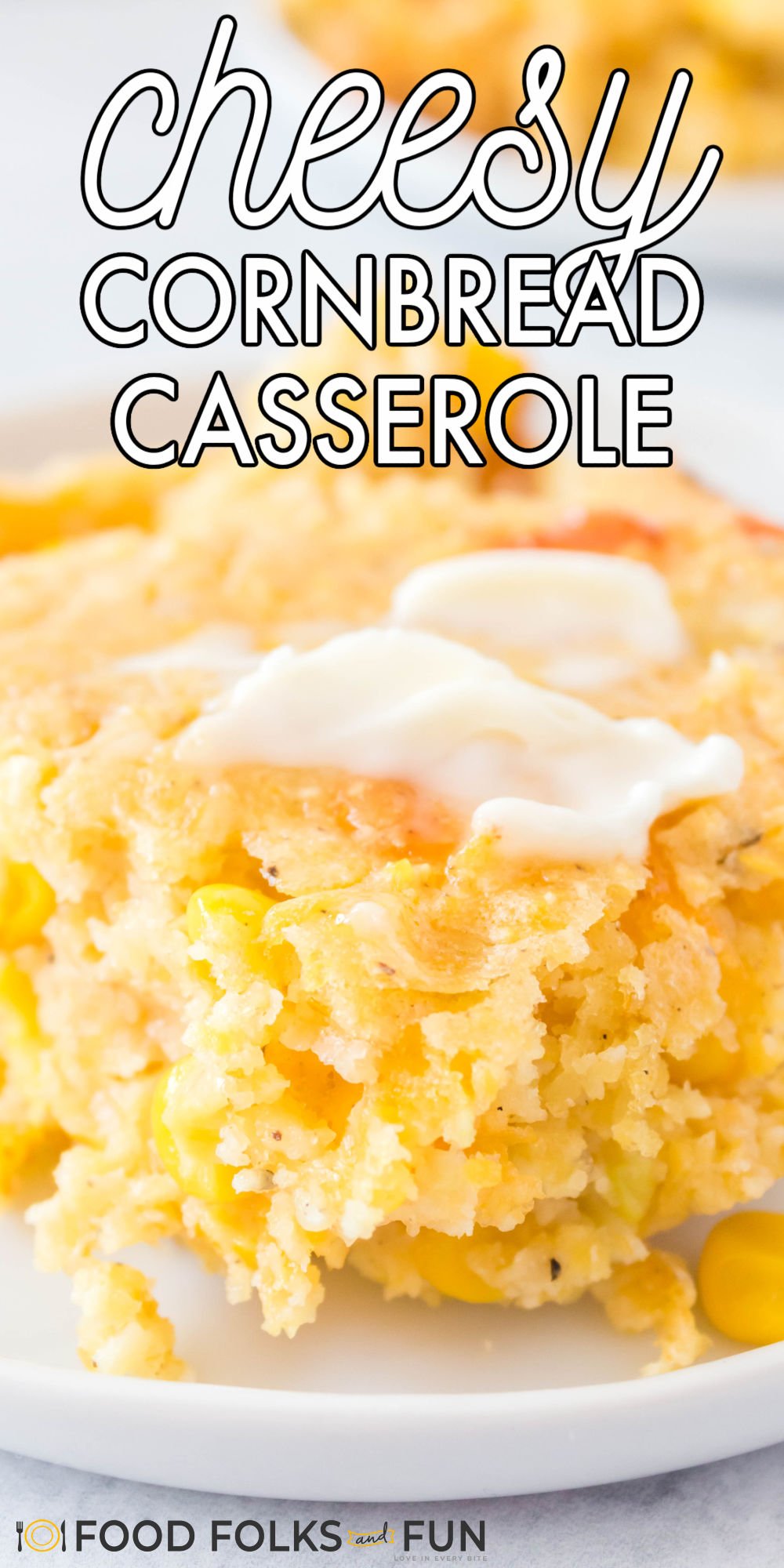Easy Cornbread Casserole with Cheese is a comforting side dish for entertaining and busy weeknights! It's quick to whip together and so delicious! via @foodfolksandfun