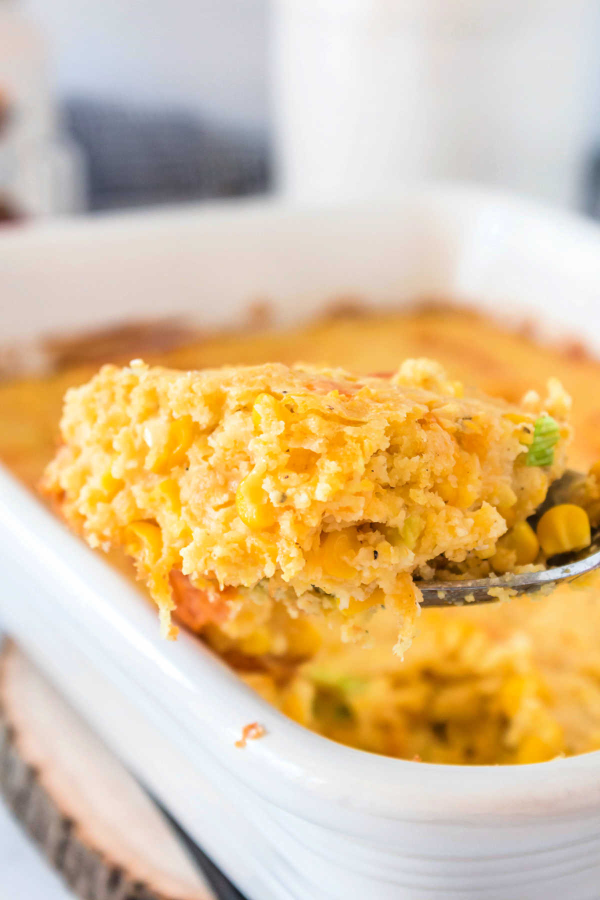 Easy Cornbread Casserole with Cheese is a comforting side dish for entertaining and busy weeknights! It's quick to whip together and so delicious! via @foodfolksandfun