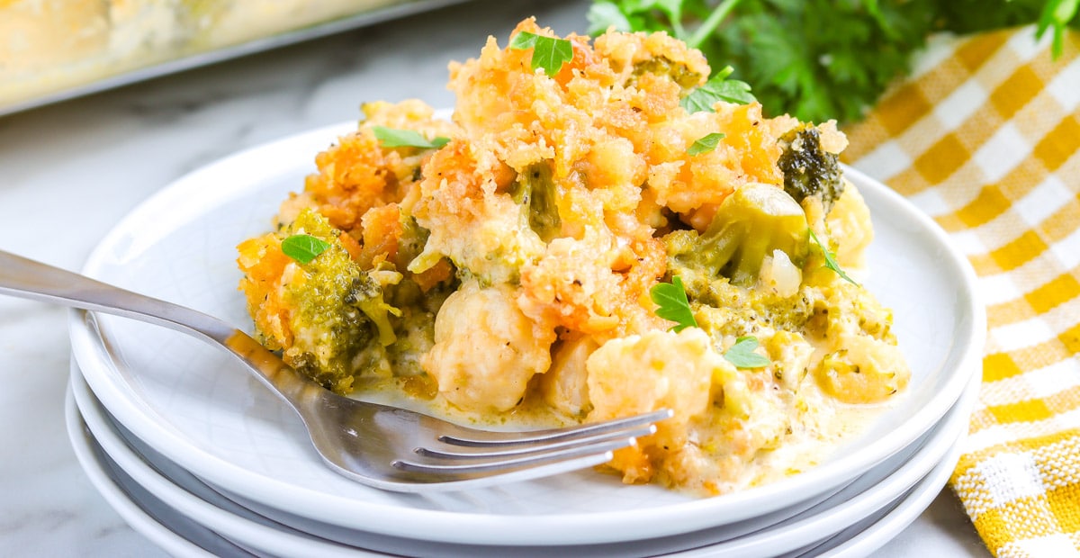 Some of the broccoli casserole on a white serving plate.