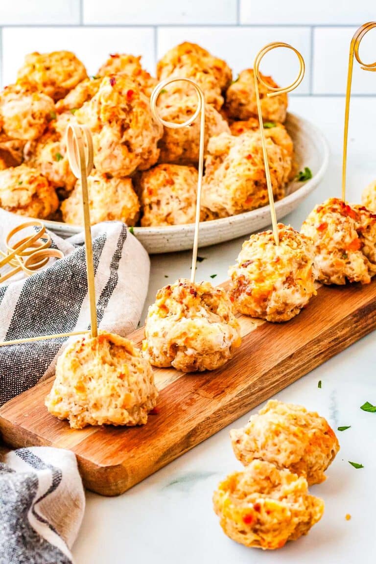 Sausage balls on a serving board and in a bowl.