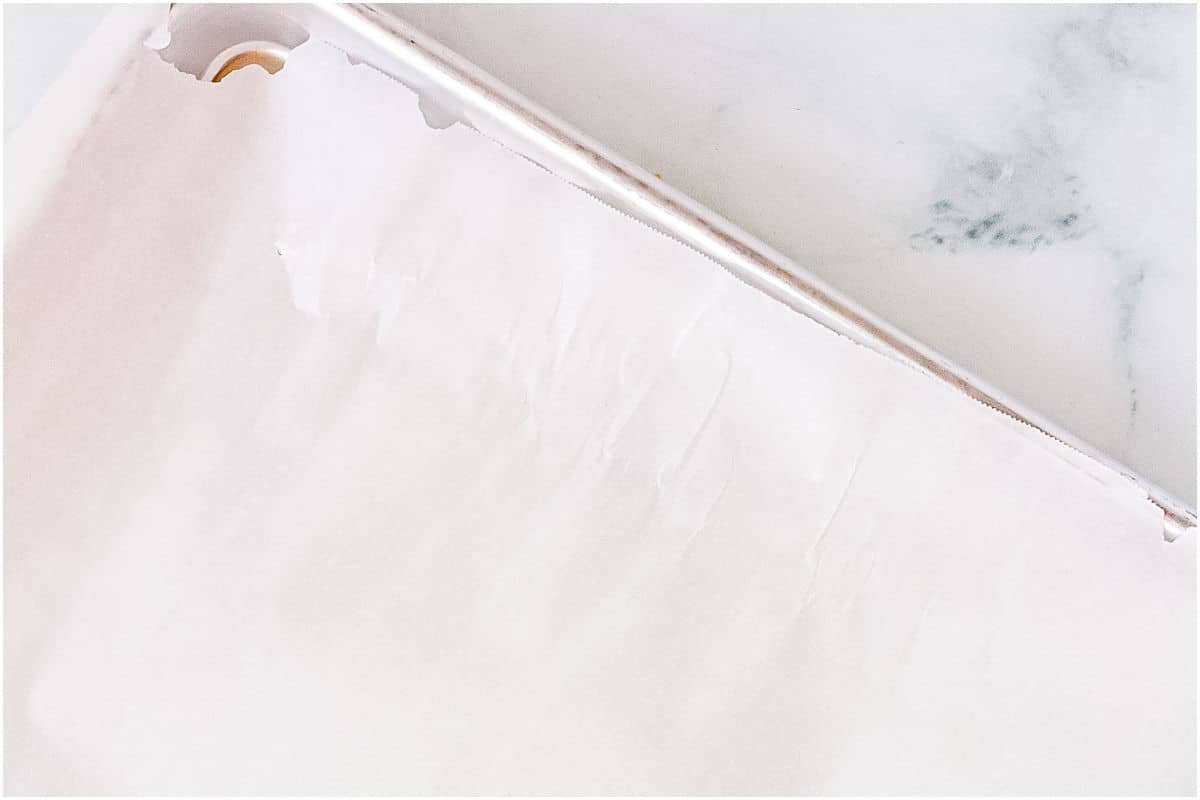 A rimmed baking sheet lined with parchment paper.