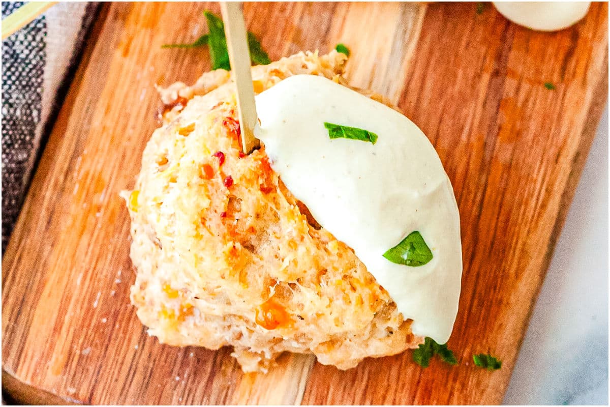 A sausage ball with a cramy mustard sauce.