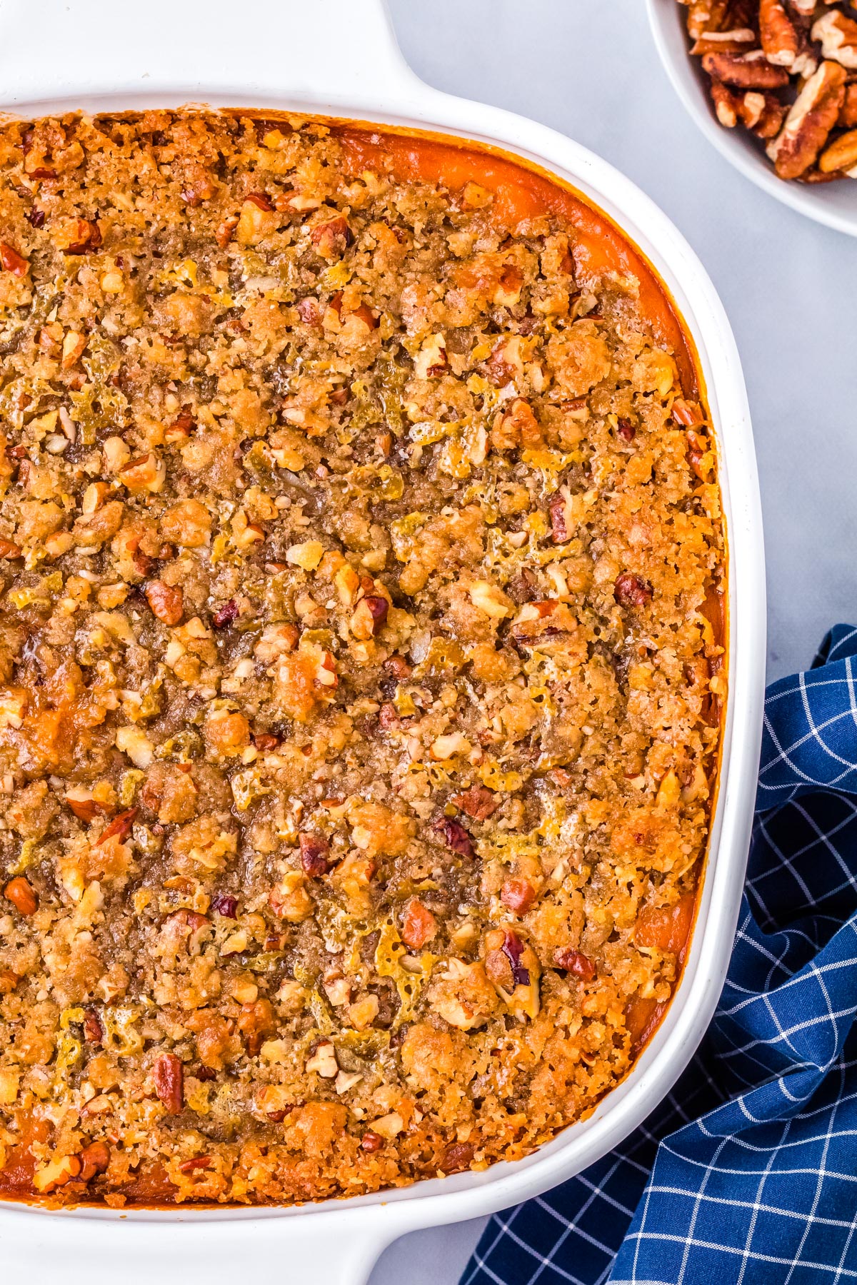 A close up picture of the Sweet Potato Soufflé so you can sew the buttery pecan topping.