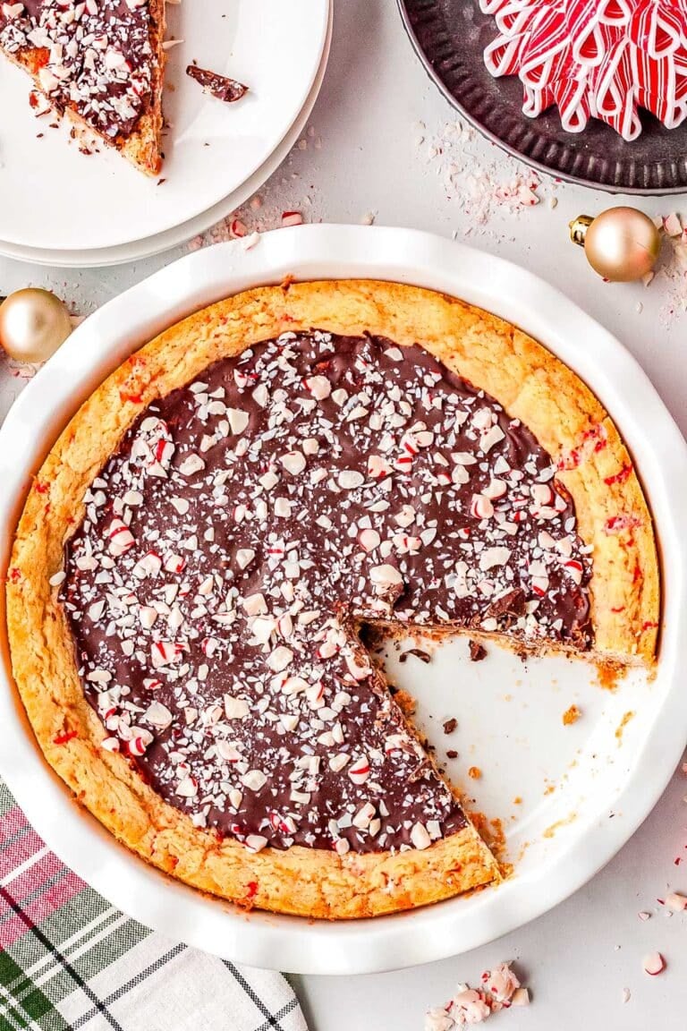 The Peppermint Bark sugar cookie pie in a white pie plate.