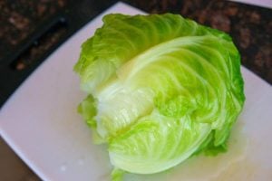 Place the cabbage head on a cutting board to cool.