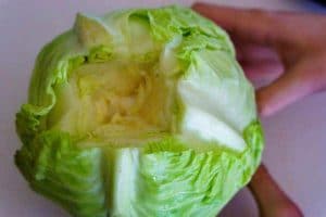 Th core cut out of a green cabbage.