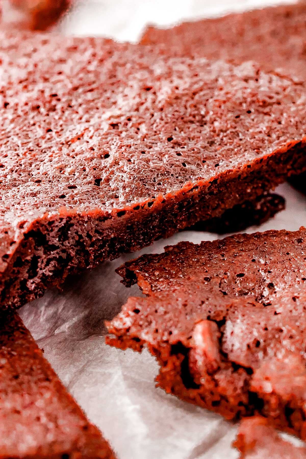 A close up of some brownie brittle pieces so you can see how thin and crisp they are. 