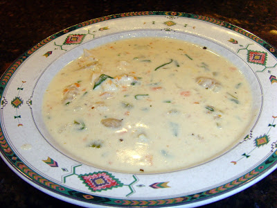 A bowl of soup on a plate