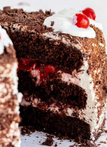 A close up picture of a slice of black forest cherry cake.