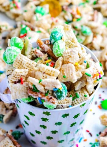 Chex mix in a St. Patrick's Day serving cup.