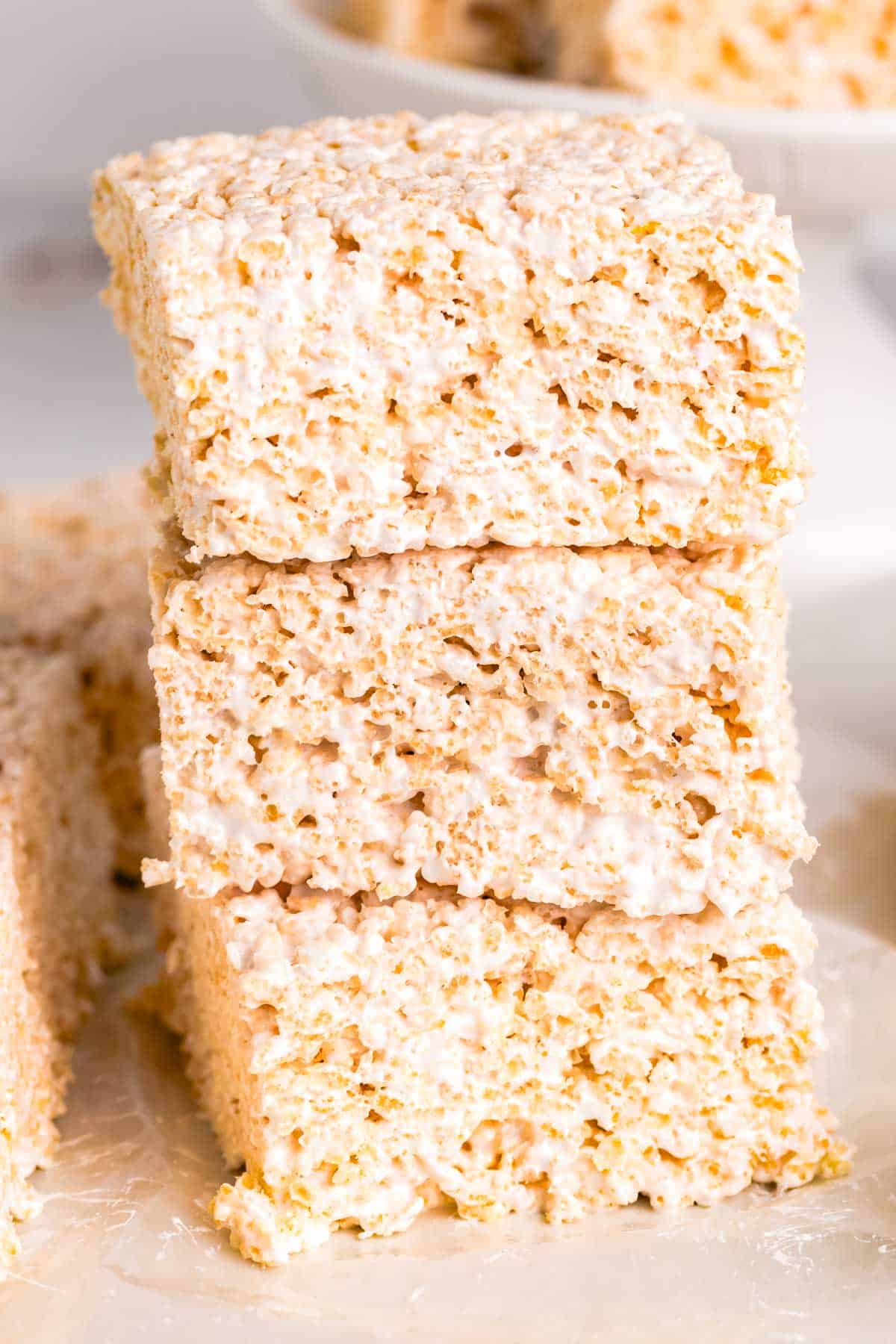 Three marshmallow fluff rice krispie treats stacked three on top of each other.