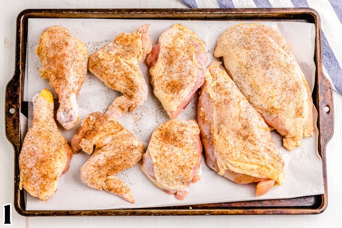 The chicken pieced rubbed with a dry rub.