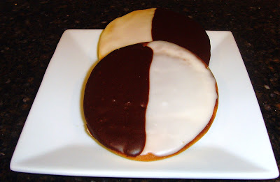 A close up of Black and White Cookies on a plate