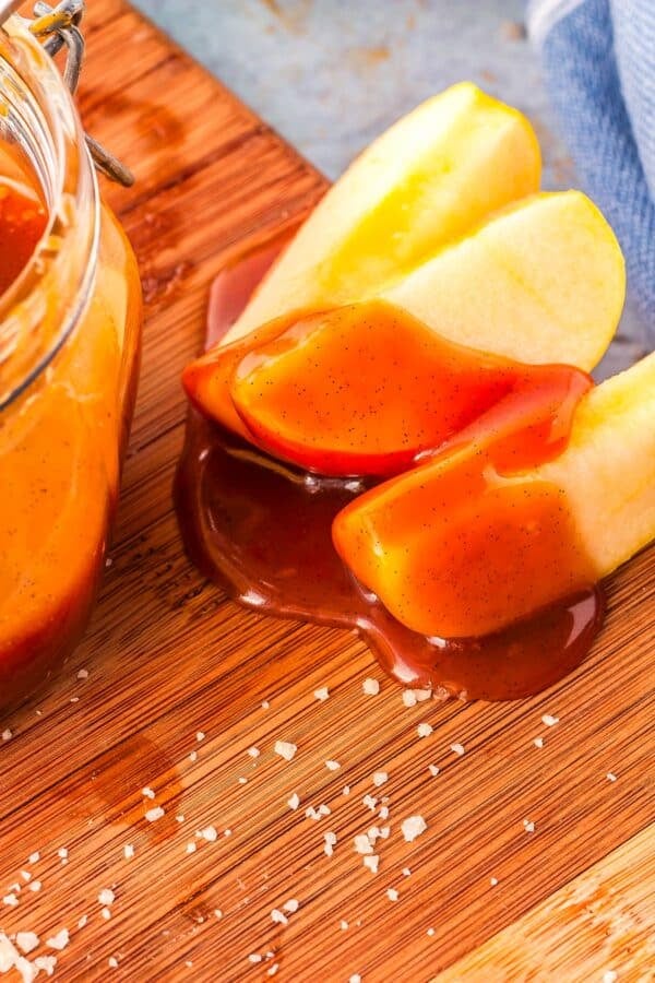 Apple slices dipped into salted caramel sauce.