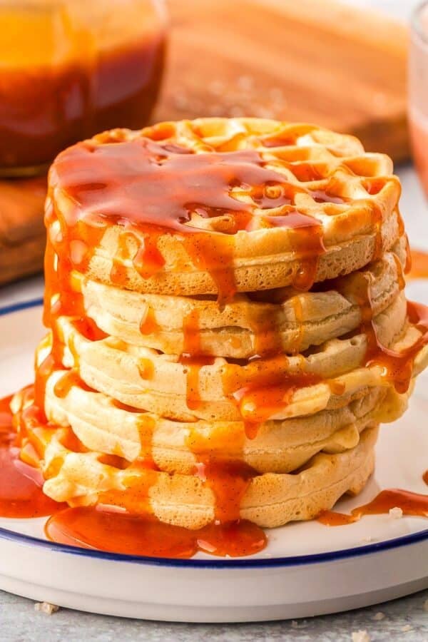 Salted caramel sauce drizzled over waffles.