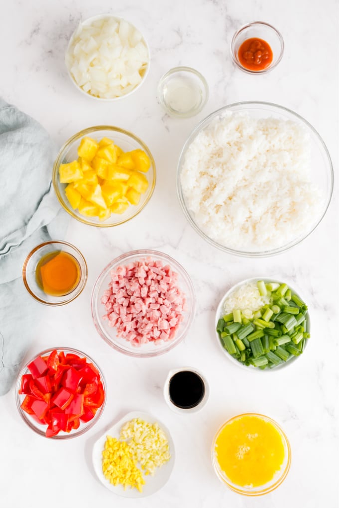 AN overhead picture of all of the ingredients needed to make Hawaiian Fried Rice. 