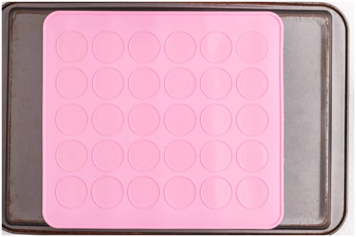 A baking sheet lined with a silicone baking mat.