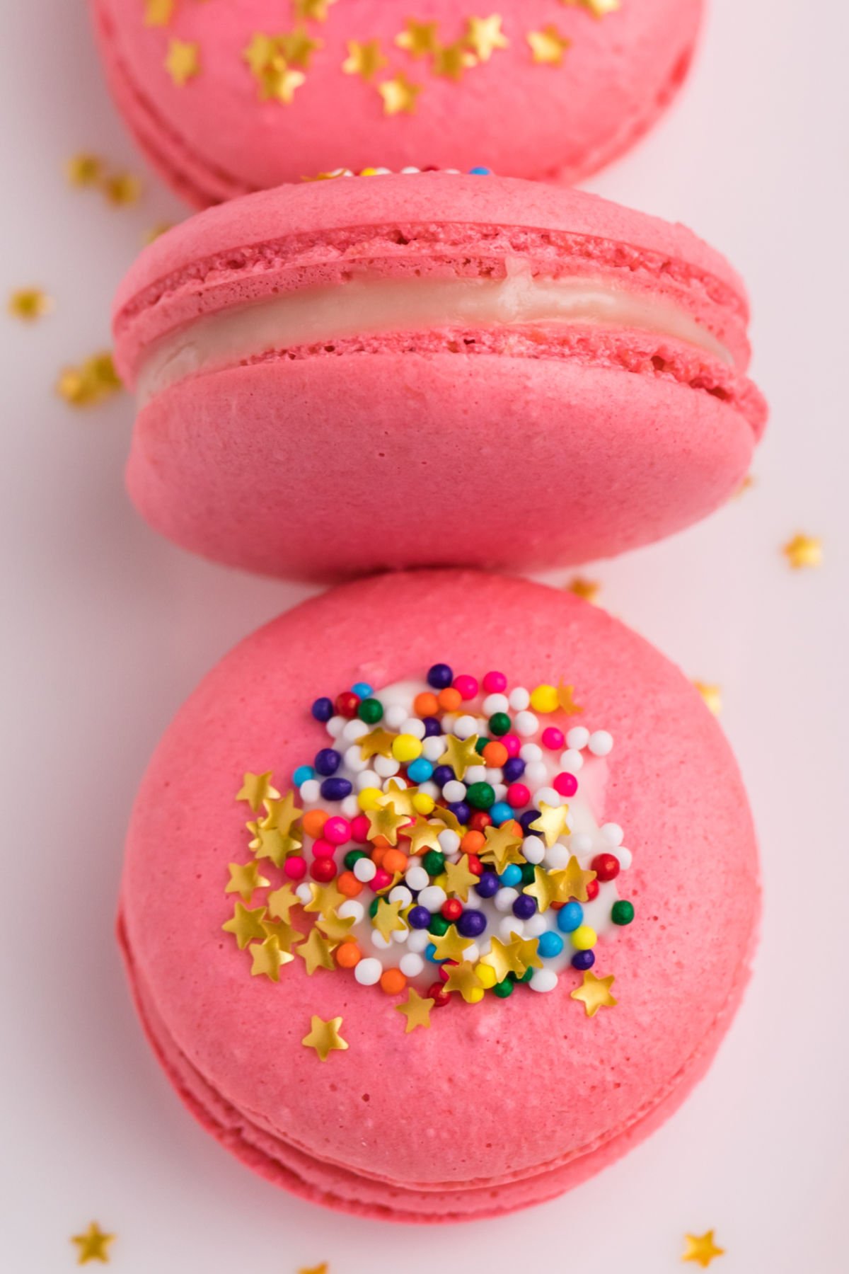 These Pink Macarons are filled with white chocolate ganache. They're perfect for any party, celebration, or holiday because you can color them any way you please.  via @foodfolksandfun