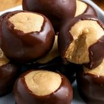 A close up of Buckeye Candy on a wooden serving platter.