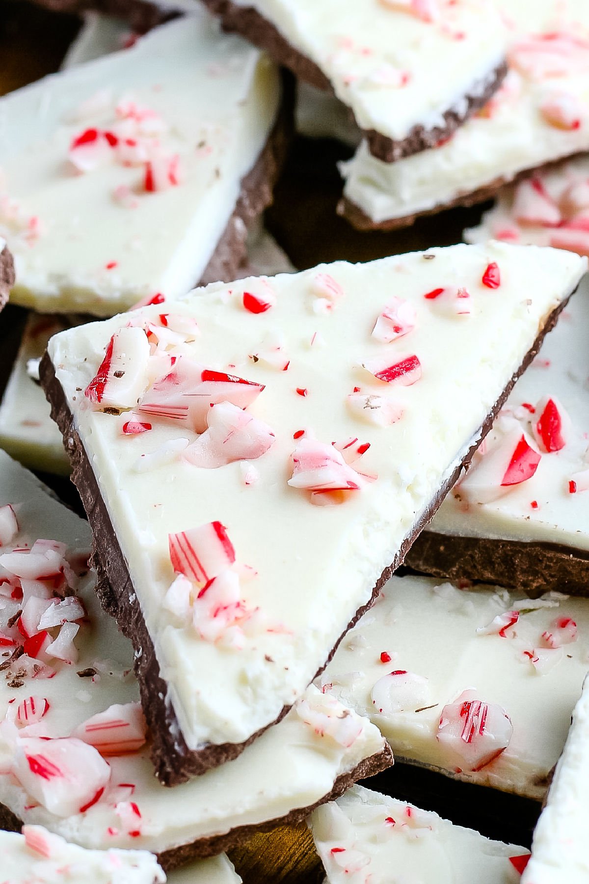 Peppermint Bark Candy makes a great holiday gift. It has layers of chocolate and white chocolate with a peppermint hint, and it's sprinkled with crushed candy canes.  via @foodfolksandfun