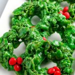 Rows of Christmas Wreath Cookies on a white serving dish.