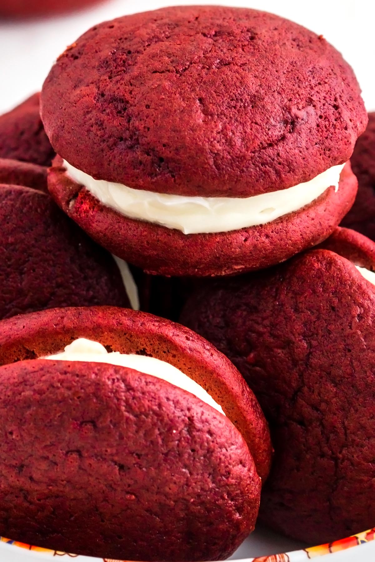 A close up picture of whoopie pies stacked on top of each other.