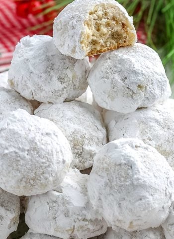 A close up picture of a pile of snowball cookies.