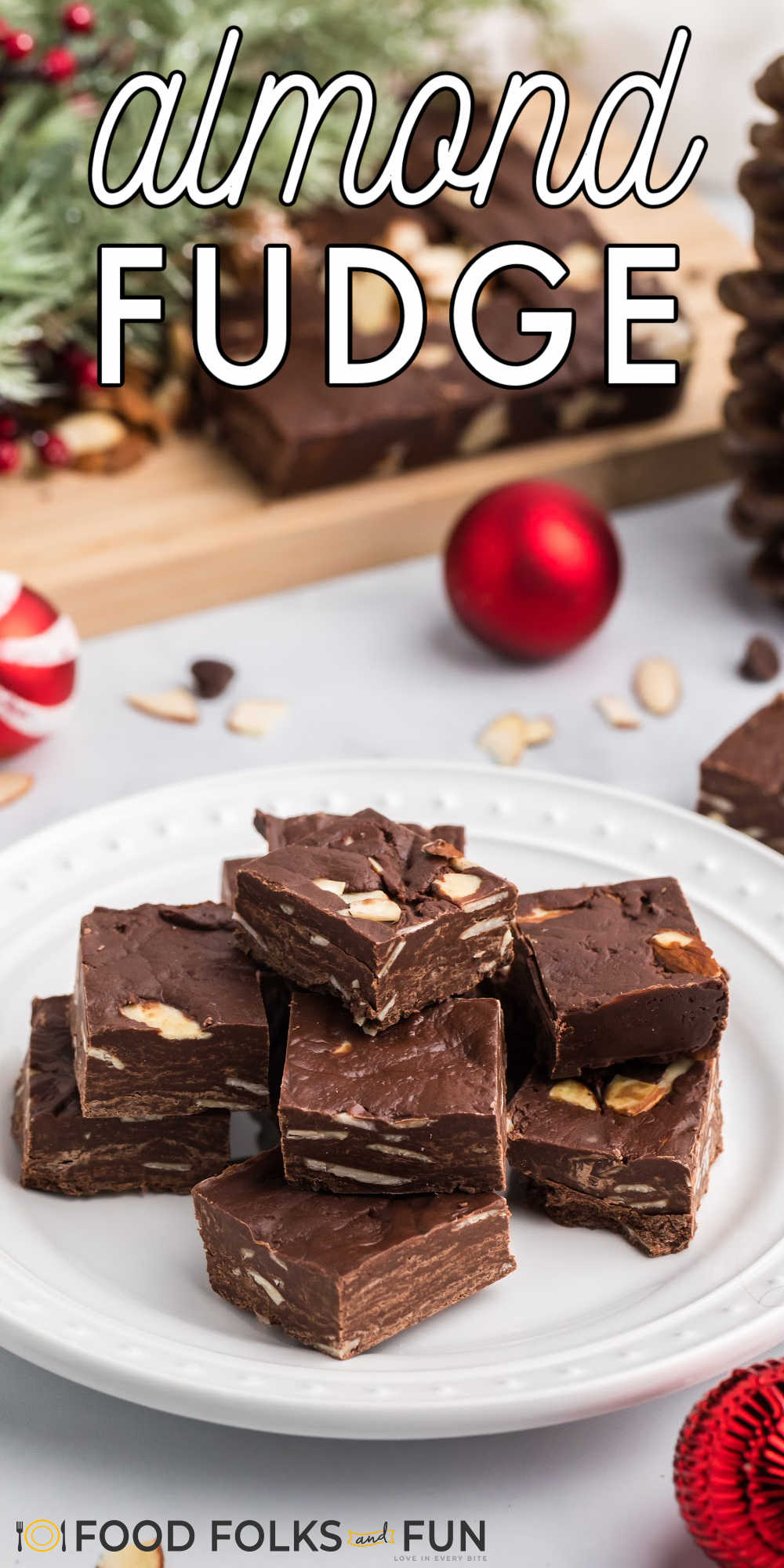 This Easy Chocolate Fudge recipe is studded with almonds and simple to make. All you need are just four ingredients to make this easy fudge!  via @foodfolksandfun