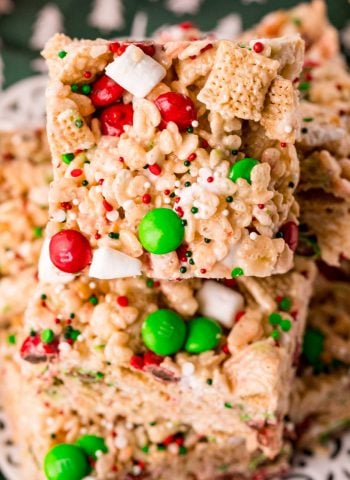 A close up picture of Christmas Rice Krispie Treats stack on top of each other.