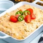 Rotel Cheese Dip in a white serving dish.