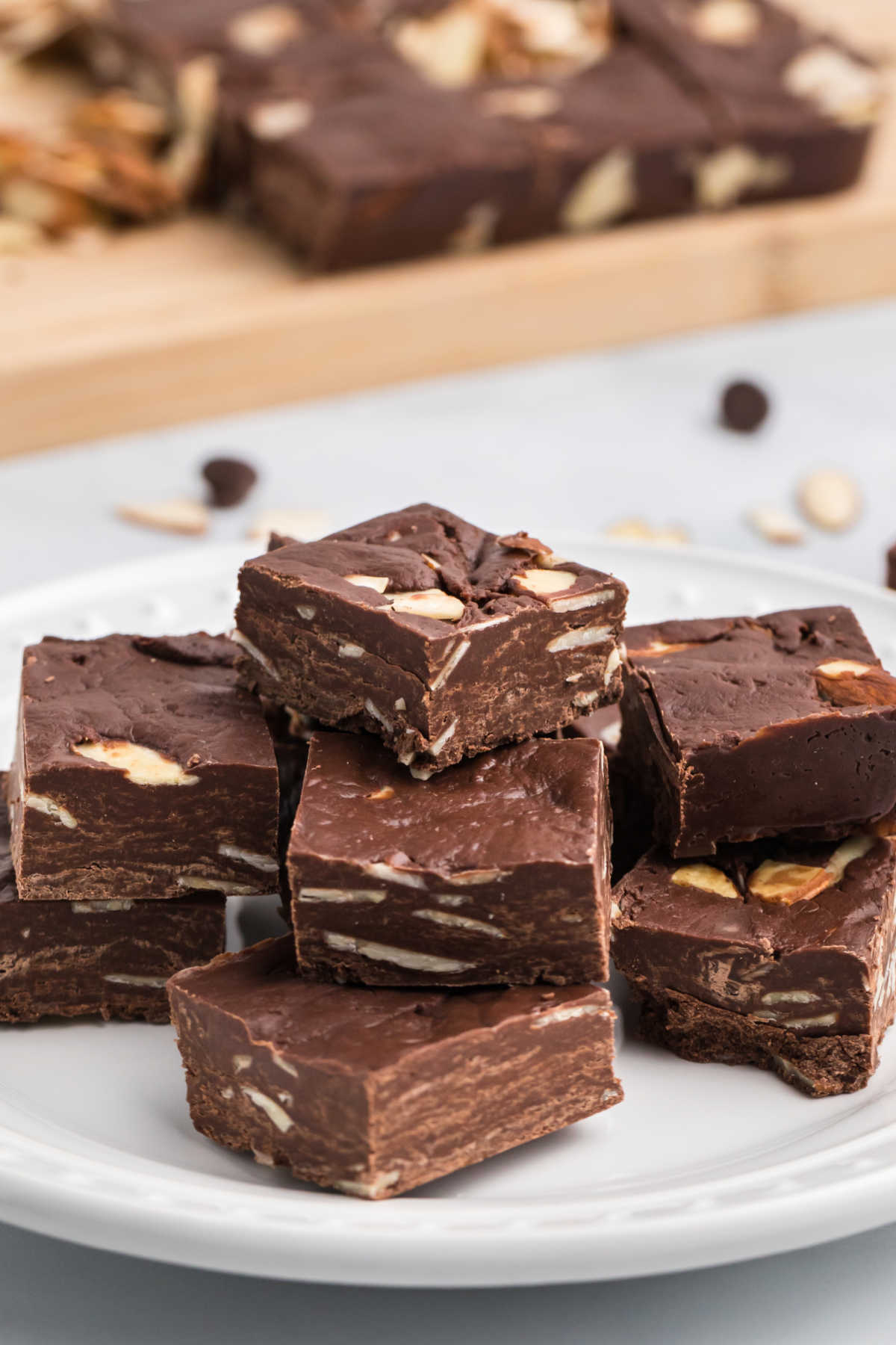 This Easy Chocolate Fudge recipe is studded with almonds and simple to make. All you need are just four ingredients to make this easy fudge!  via @foodfolksandfun
