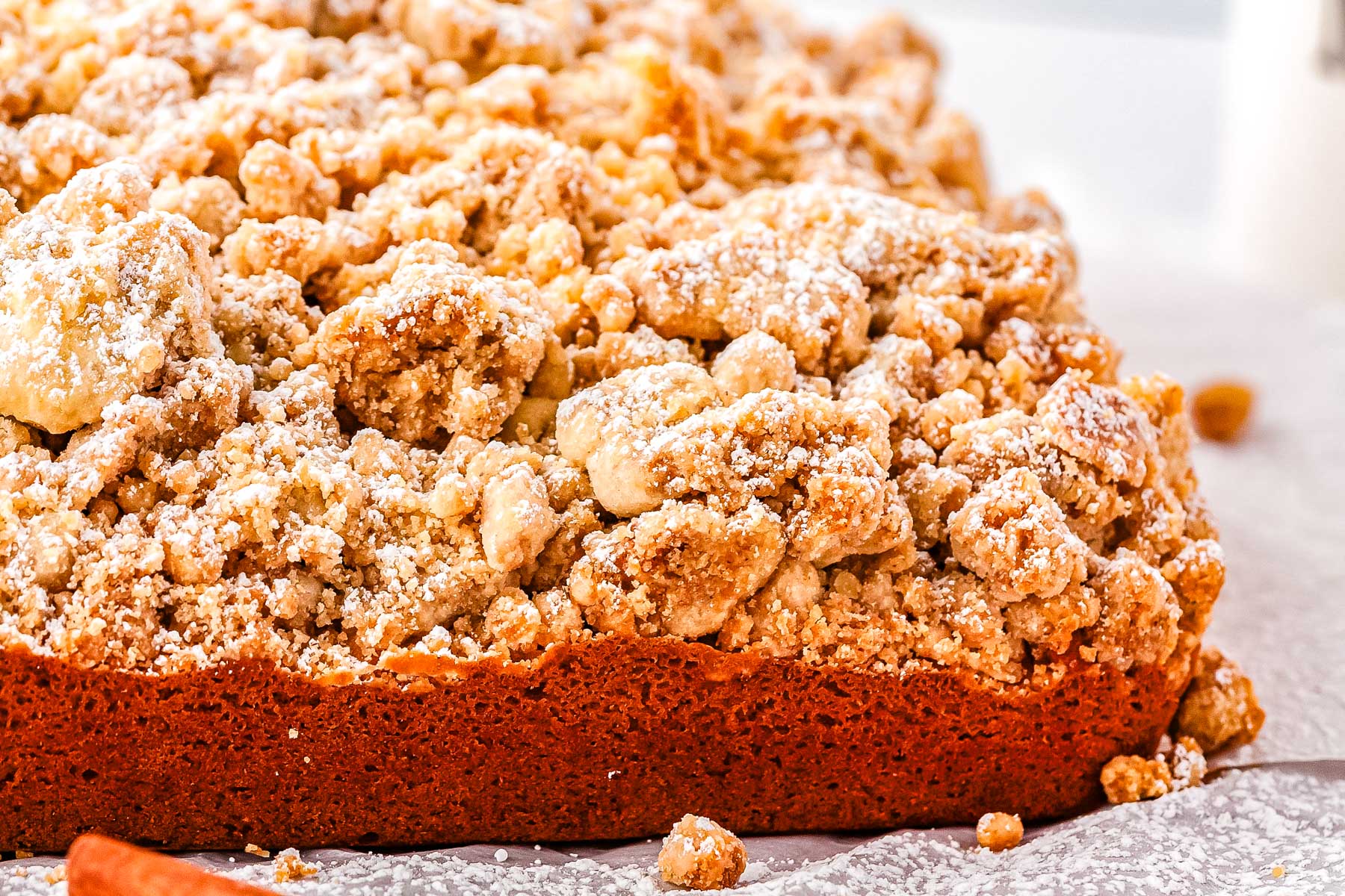 A crumb cake on a piece of parchment paper.