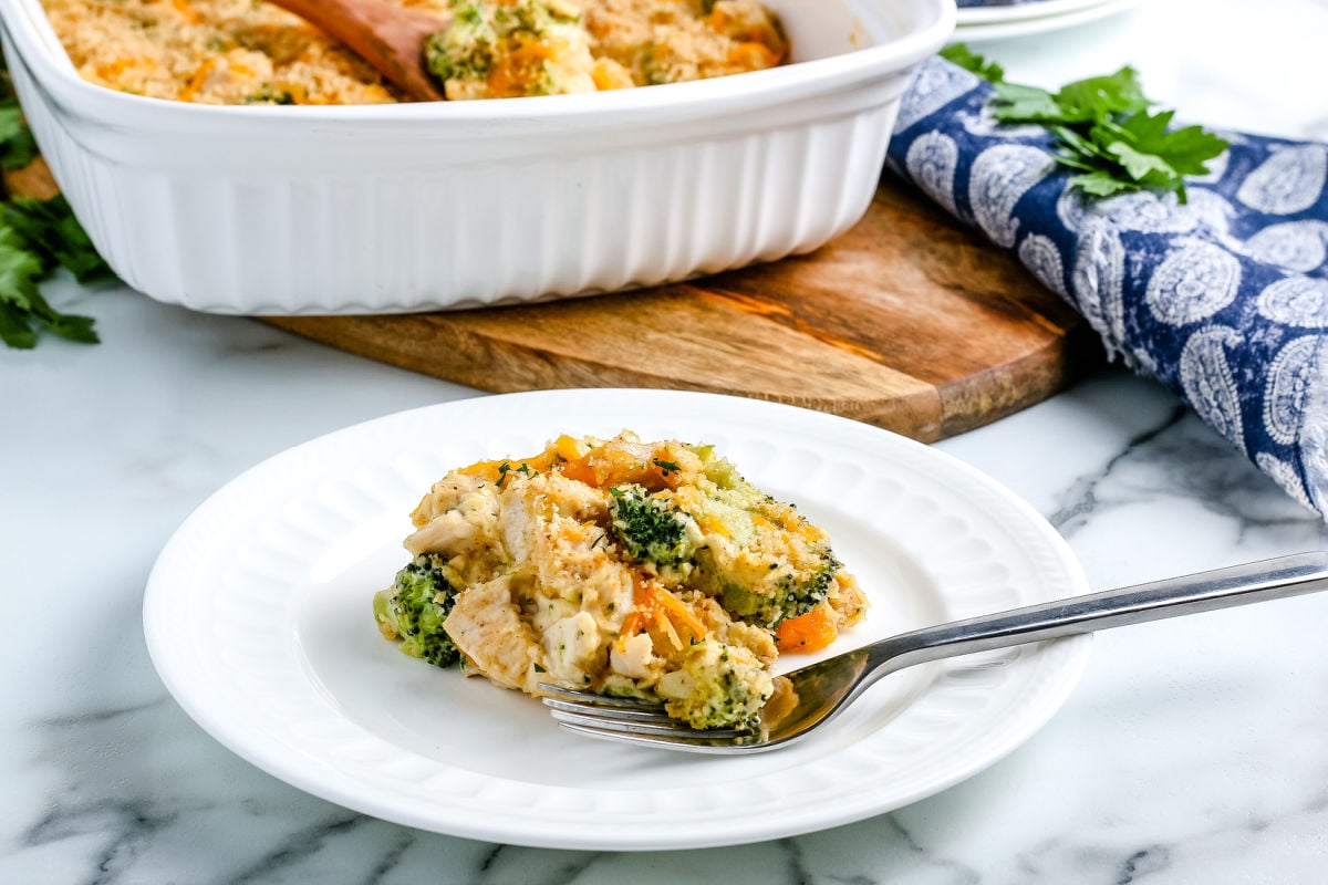 Chicken Divan with Broccoli on a white plate with a fork.