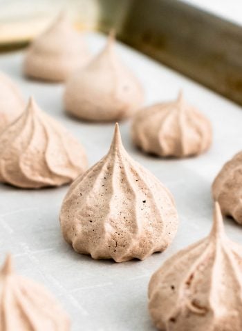 The finished Chocolate Meringue Cookies on a baking sheet.