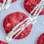 The finished red velvet white chocolate chip cookies on a white platter.