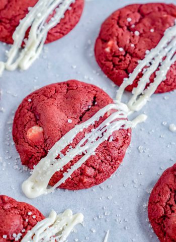 The finished red velvet white chocolate chip cookies on a white platter.