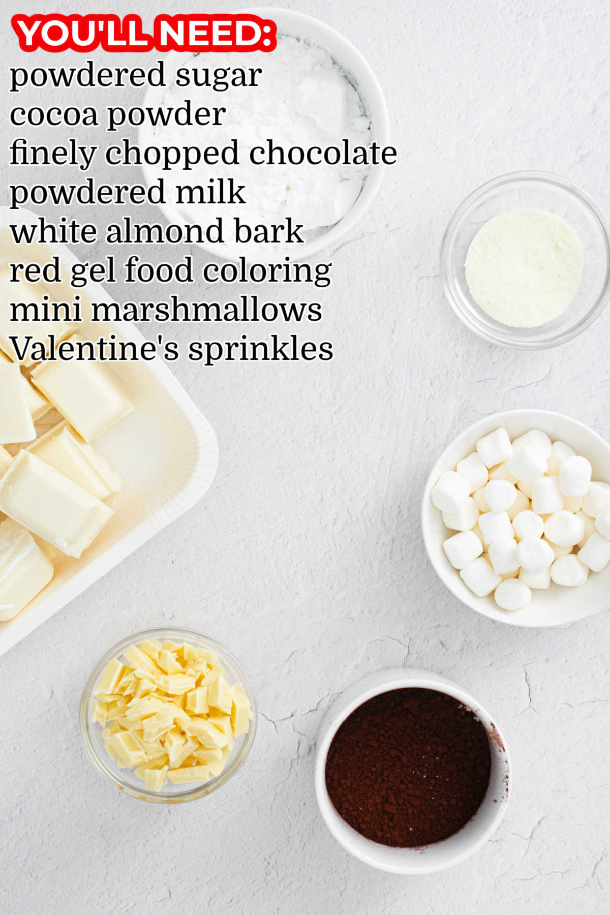 All of the ingredients needed to make Red Velvet Hot Chocolate Bombs.