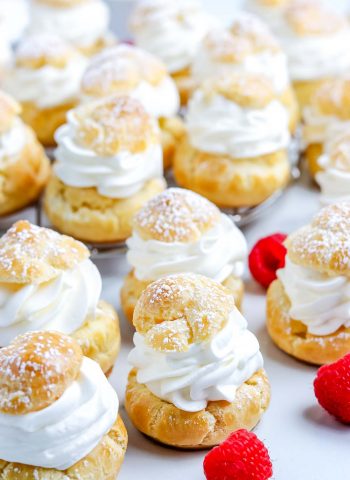 The finished Cream Puffs on a white serving platter.