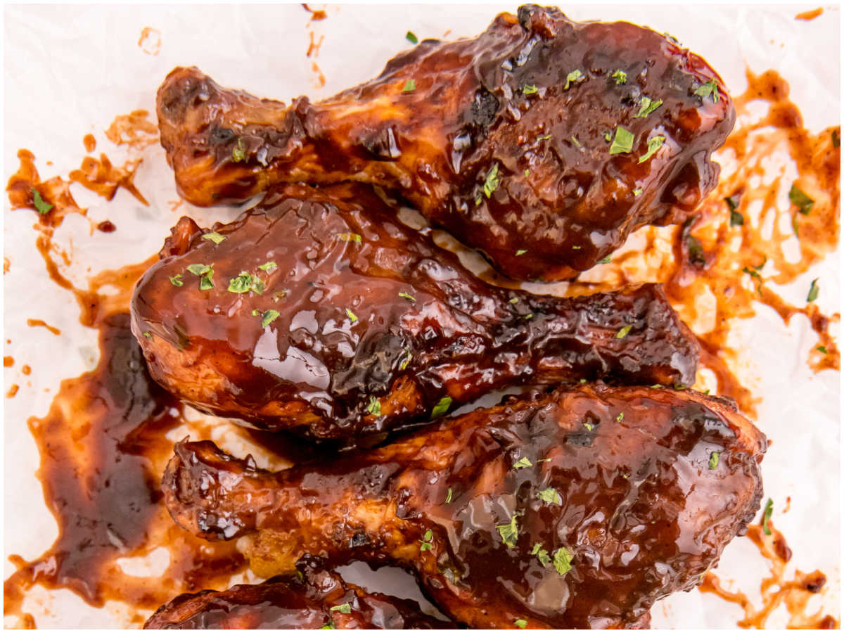 The finished drumsticks coated in BBQ sauce.