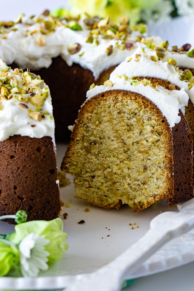 The finished Pistachio Bundt Cake recipe with slices taken out of the cake.