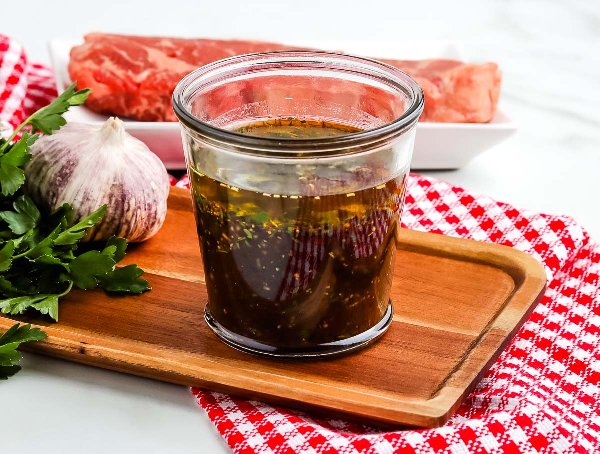 Steak marinade in a clear glass jar.